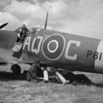 Ground crew loading a dinghy into a Spitfire Mk IIA, serial P8131 AQ-C of No. 276 Squadron RAF at Warmwell