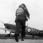 Pilot of No. 64 Squadron RAF running towards his Spitfire Mk Ia as the Squadron is scrambled at Kenley – Battle of Britain 15 August 1940