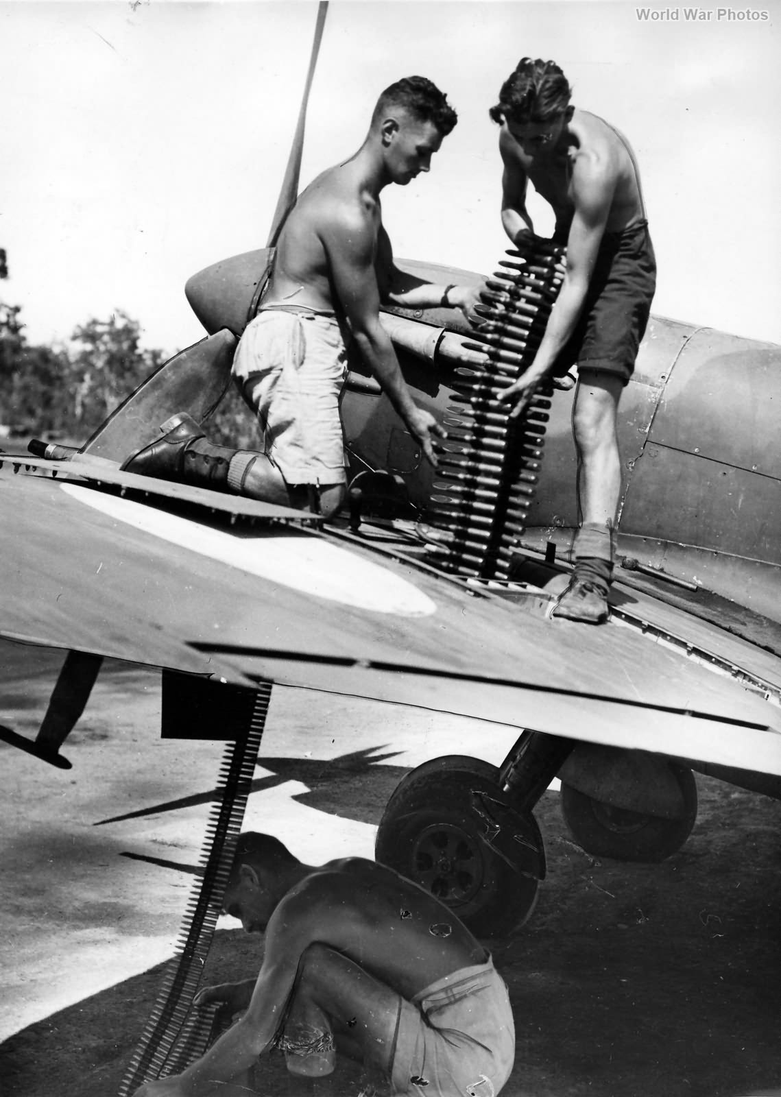 Loading ammunition into RAAF Spitfire