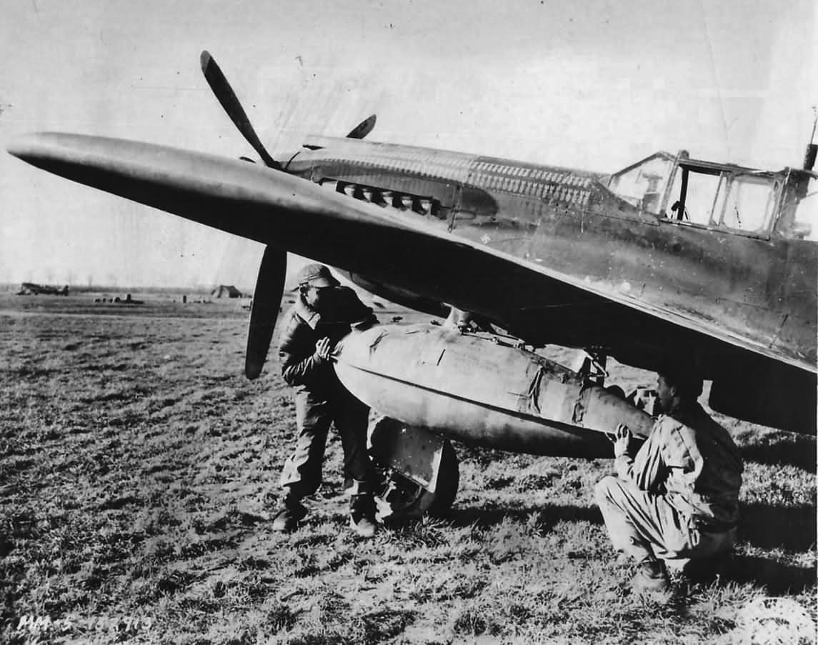 Soldiers Load K and D Rations in Auxiliary Gas Tank on A-36 1944