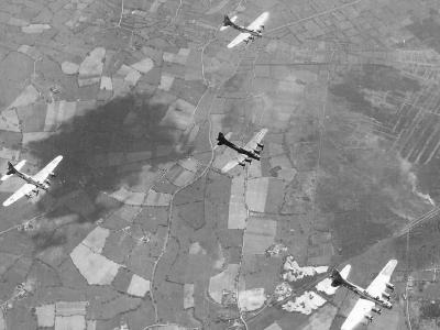 B-17 bombers flying over countryside 384 BG