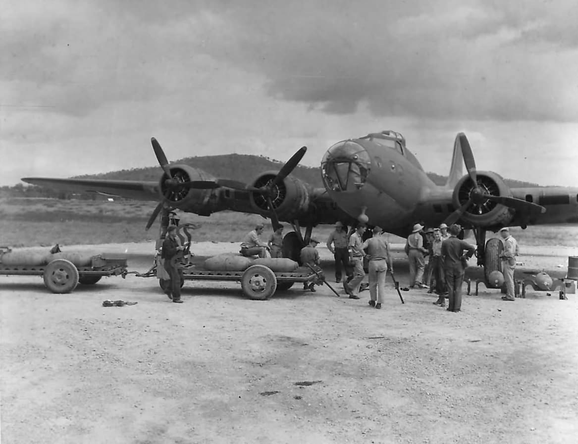 Crew loading 500 lb bombs on Boeing B-17E in Australia 1942