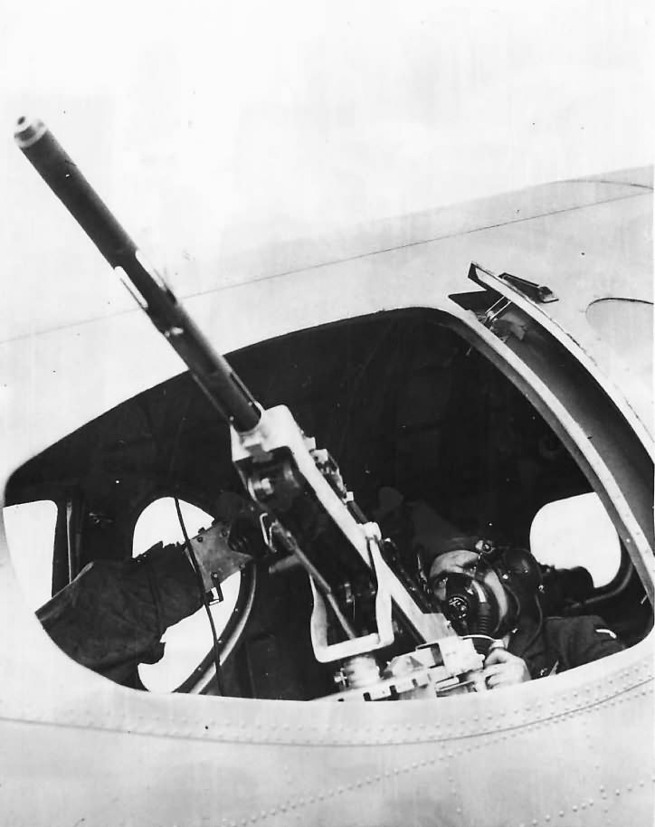 Waist gunner mans .50 caliber M2 Browning machine gun on Boeing B-17C