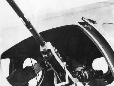 Waist gunner mans .50 caliber M2 Browning machine gun on Boeing B-17C