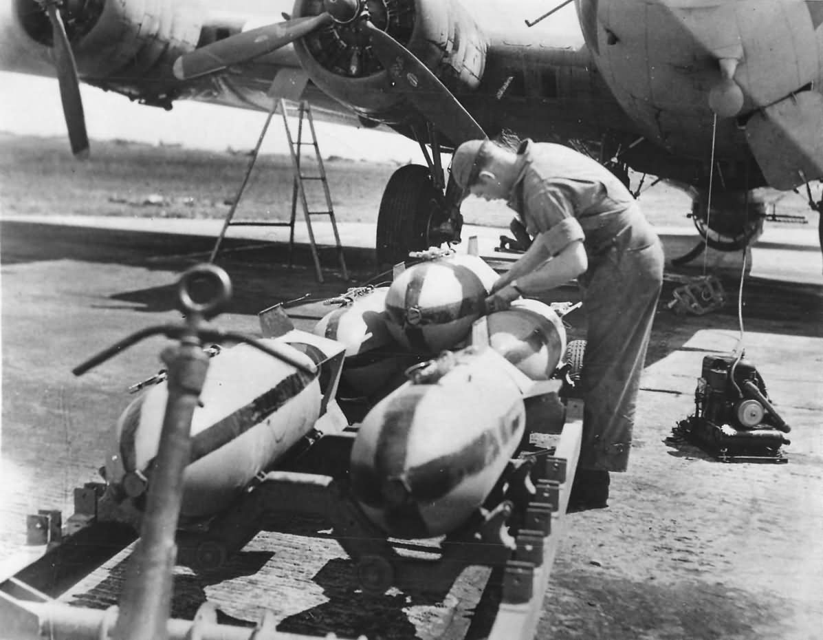 USAAF Crewman Prepares to Load Bombs on B-17 Flying Fortress at Station in England July 1943