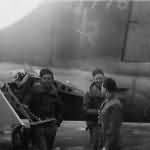 B-17 US Airmen by Flak Damaged Tails Section