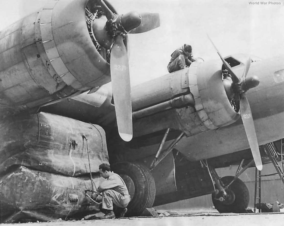 Mechanic uses British lifting bag to work on B-17 8th AF 43