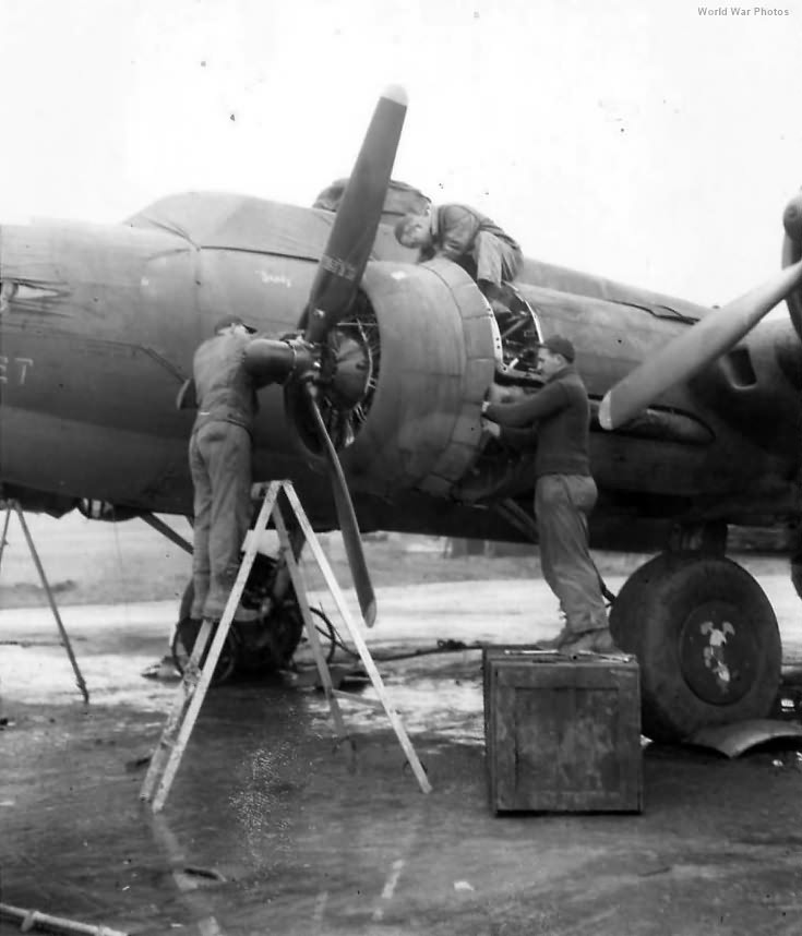 Ground personnel of the 303rd BG work on the engines of B-17 41-24603 The Green Hornet 1943