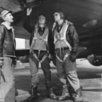 Pilots and Crew Chief check supercharger on B-17