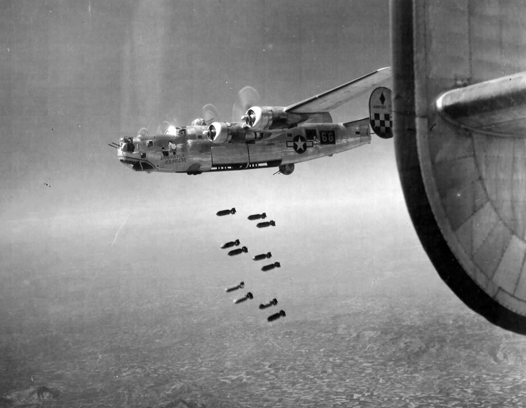 B-24L of the 459th Bomb Group, 756th BS drop bombs on a railroad bridge at Padua Italy