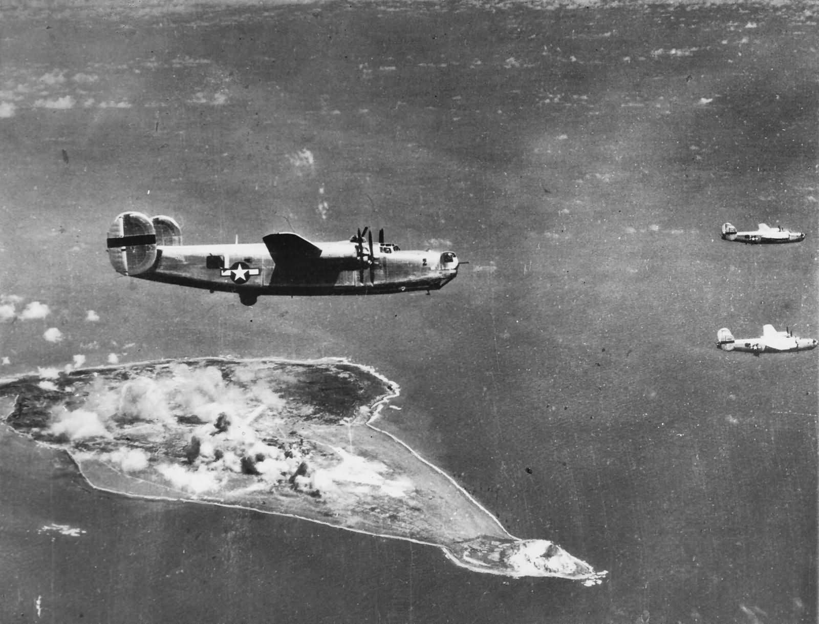 B-24 Liberators of the 30th Bomb Group, 819th BS fly over Iwo Jima on 15 February 945
