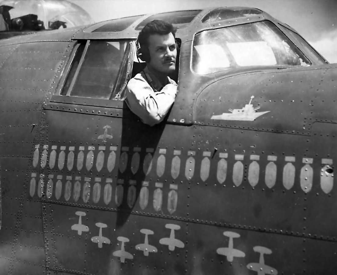 Col. Bullis of Jolly Rogers 90th BG by Scoreboard on B-24 1944