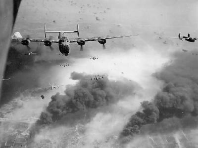 Head On View B-24 Liberator Bomber Group in Intense Flak Over Burning Target
