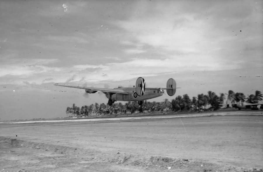 British Liberator B Mk VI KN752 code „F” of No 356 Squadron RAF takes off from the unfinished runway at Browns West Island