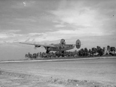 British Liberator B Mk VI KN752 code „F” of No 356 Squadron RAF takes off from the unfinished runway at Browns West Island