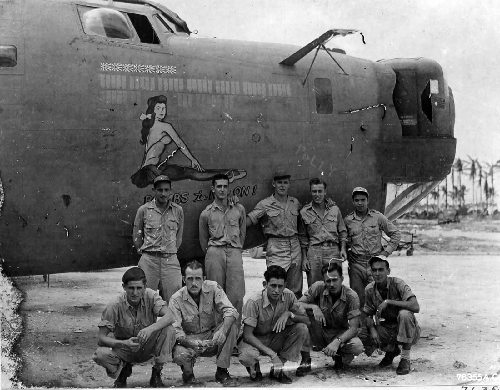 Lt. Woodard and crew of the 394th Bomb Squadron 5th Bomb Group pose beside the B-24 „Bombs To Nip On!”