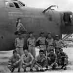 Lt. Woodard and crew of the 394th Bomb Squadron 5th Bomb Group pose beside the B-24 „Bombs To Nip On!”