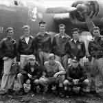Crew of the 43rd Bomb Group poses beside a Consolidated B-24 „Stuggotts 1st” at Dobodura Airstrip Papua New Guinea
