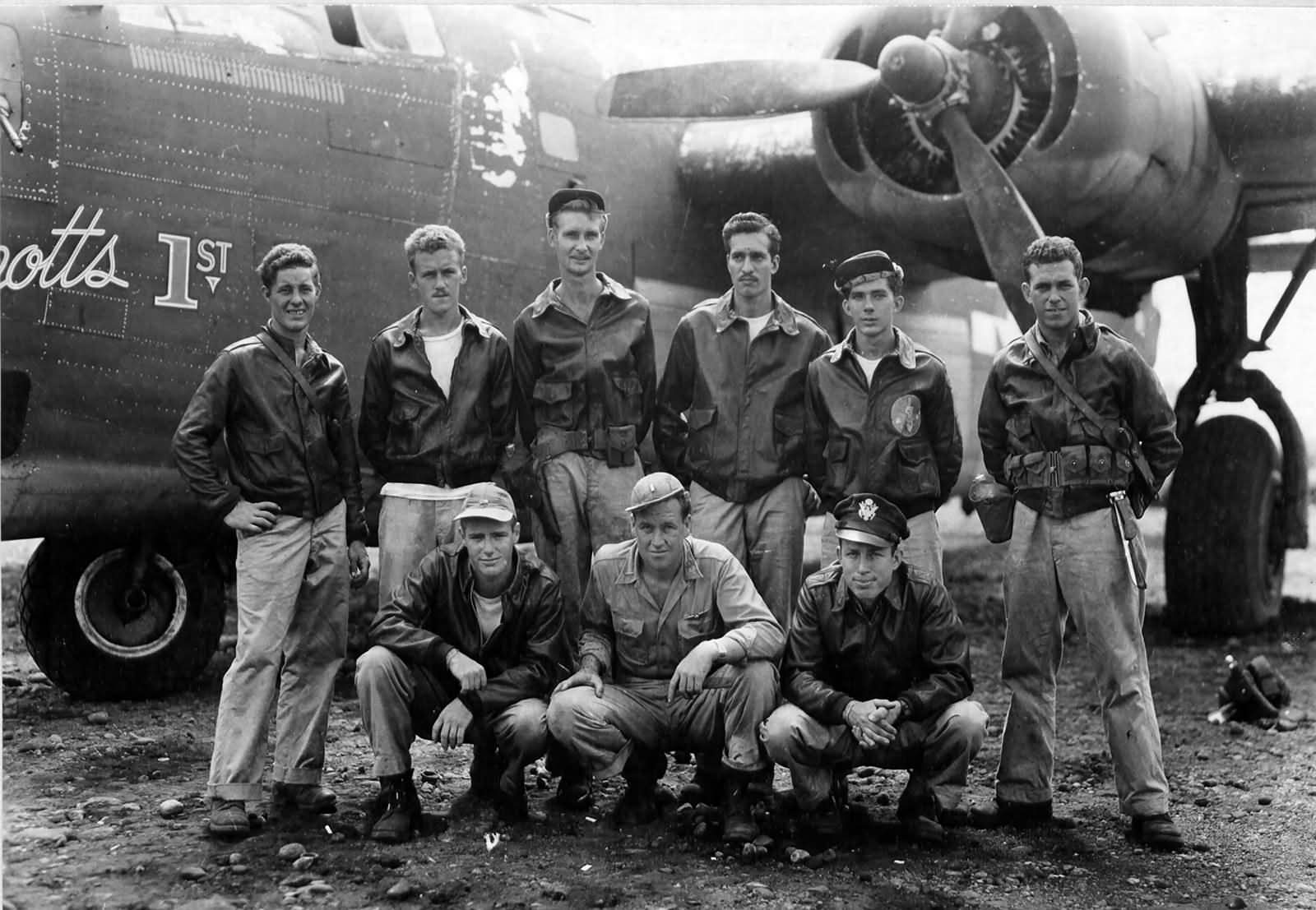 Crew of the 43rd Bomb Group poses beside a B-24 at Dobodura Airstrip Papua New Guinea