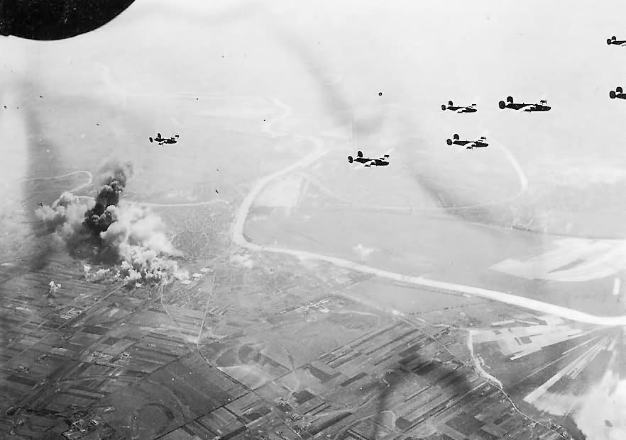 B-24 Bombers Leaving Smoking Target Area After Bombing