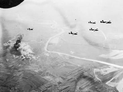 B-24 Bombers Leaving Smoking Target Area After Bombing