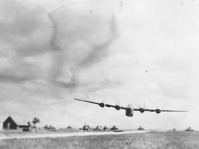 B-24 Liberator flight cross the airfield at very low level