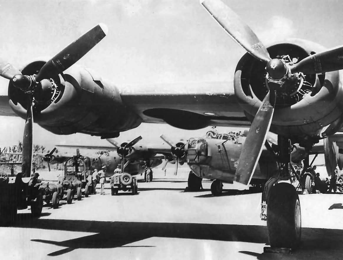 B-24 of 7th AF ground crews load bombers at a Marshall Islands airstrip for strike on Guam 1944