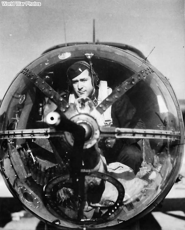 1st Lt Ralph G McConnell occupying his position in the nose of his B-26 1944