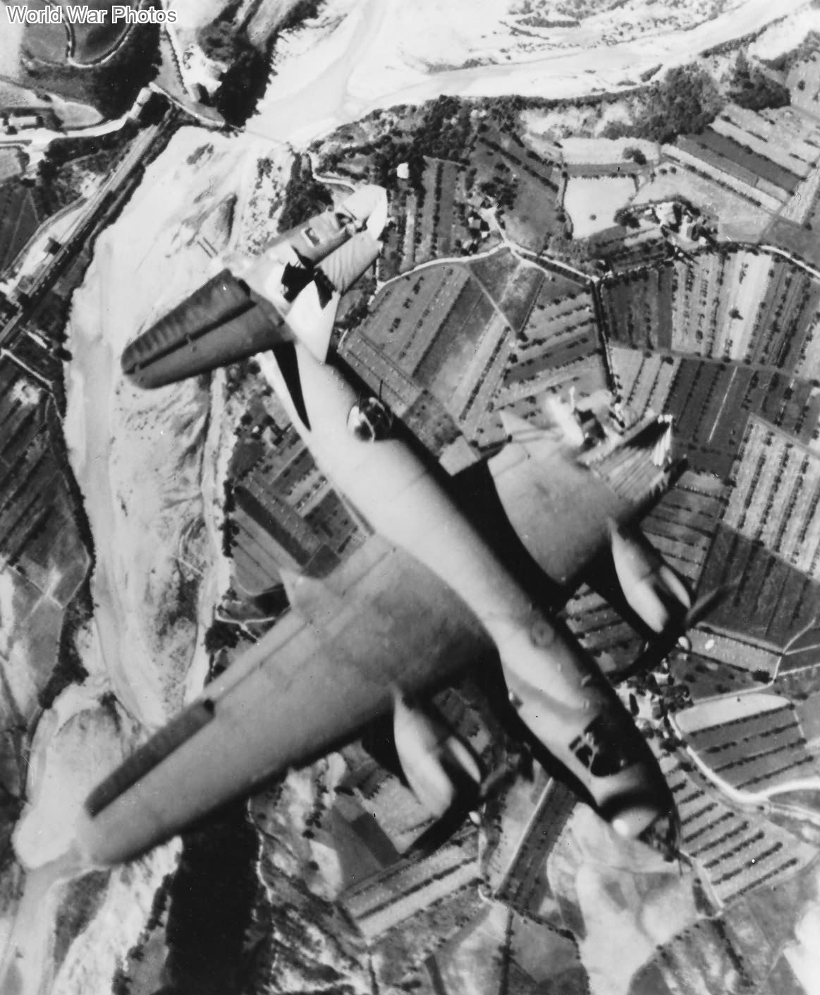 B-26 42-107566 06 during an attack on rail bridge at Marzabotto, Italy Jul 10, 1944