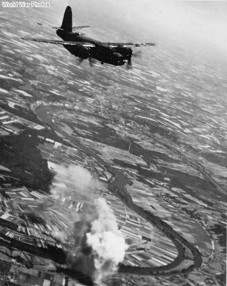 B-26 Bombers attacking target along Seine River France