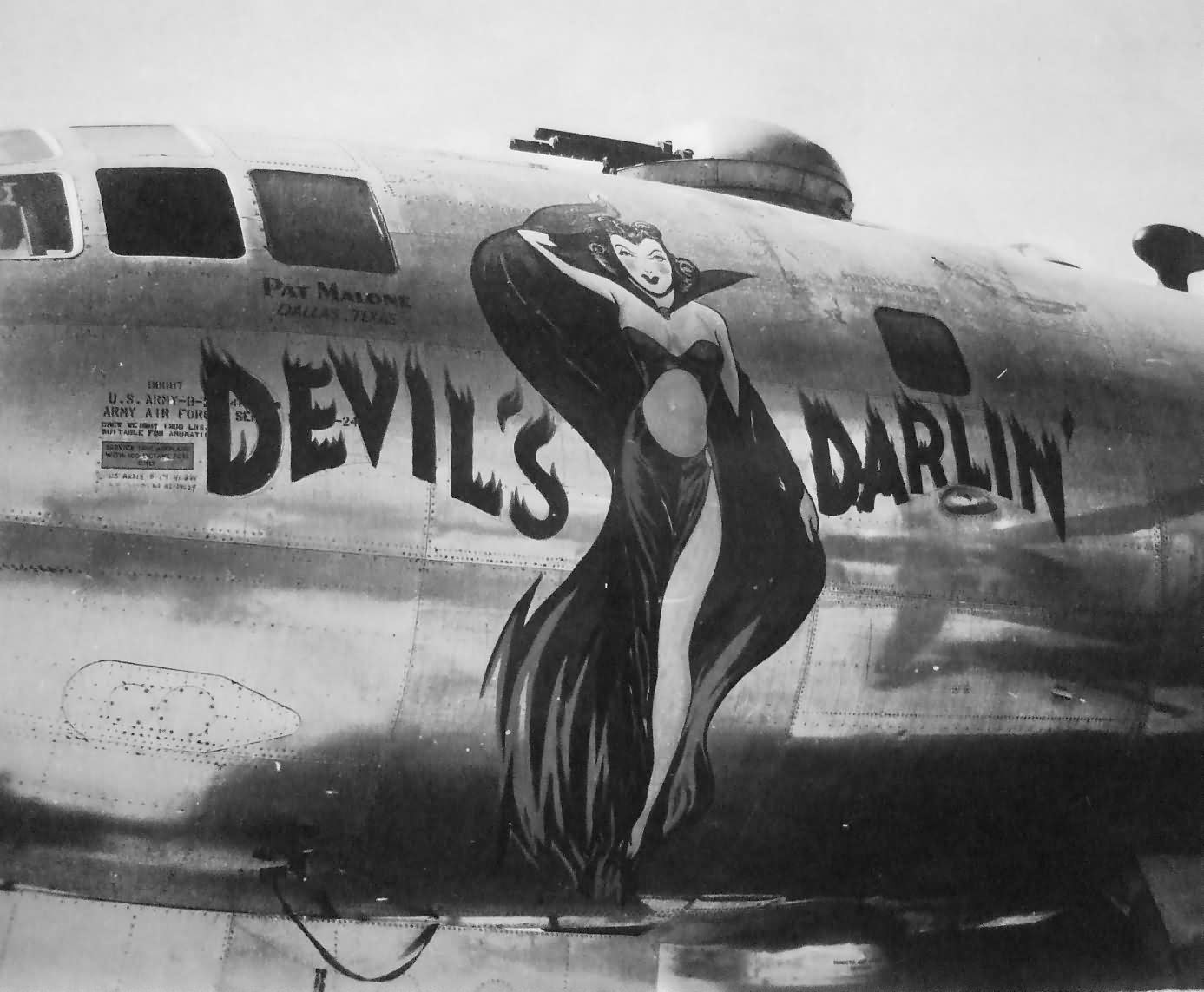 B-29_bomber_DEVIL_S_DARLIN_nose_art_Tini