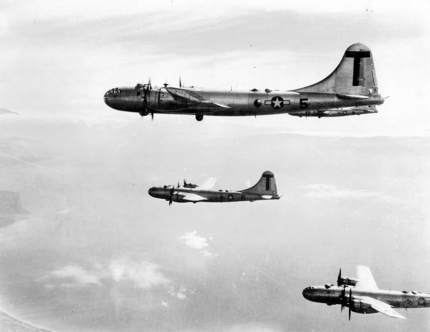 B-29 Superfortress T 5 and 6 from 498th Bomb Group fly into Japan