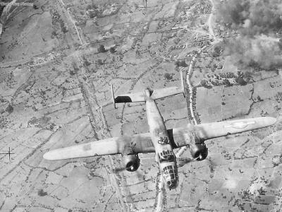 B-25 leaving burning target below