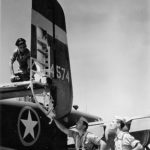 Aircrew checking out Flak damage on their B-25 ’43
