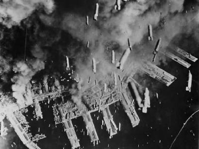 Bombs falling from B-29s on Port of Kobe ’45
