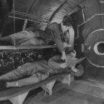 Crewmembers relax on bunks in crew compartment of B-29