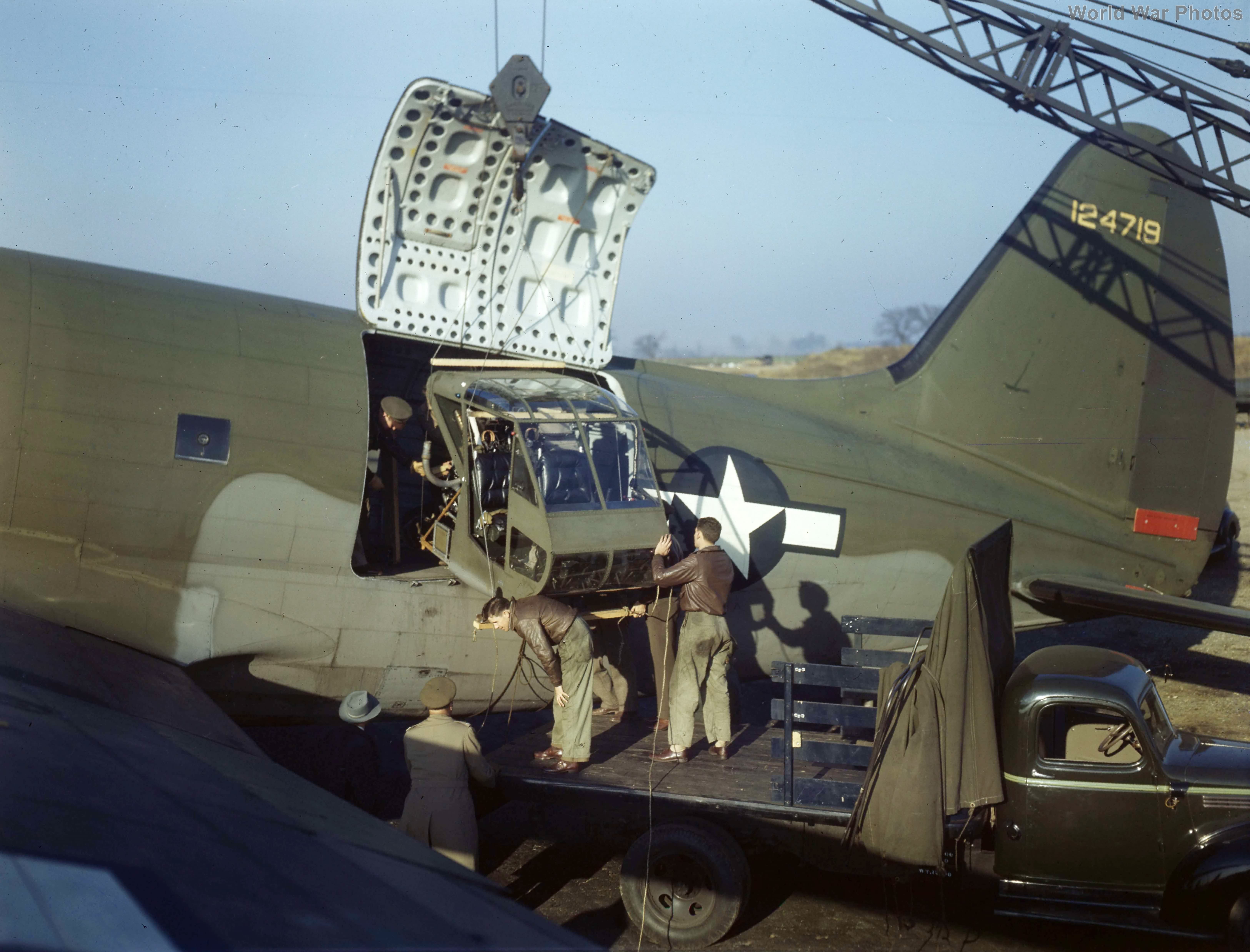 Airmen load Sikorsky R-4 into a C-46