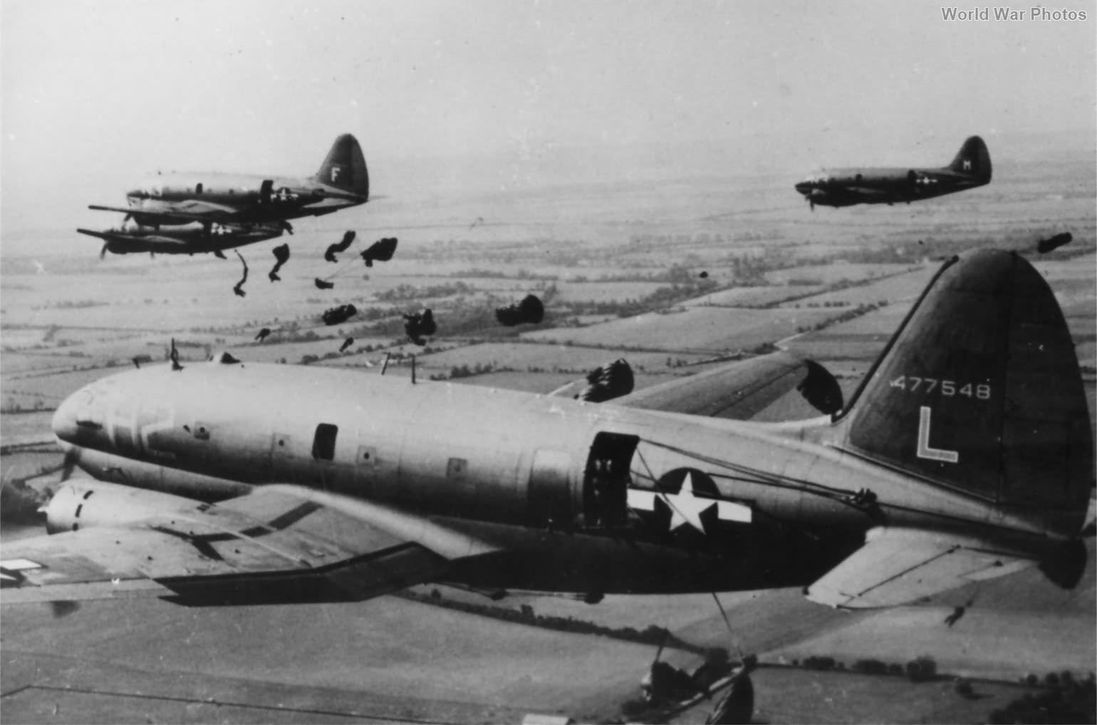 Paratroopers jumping from a C-46 44-77548 313th TCG 2