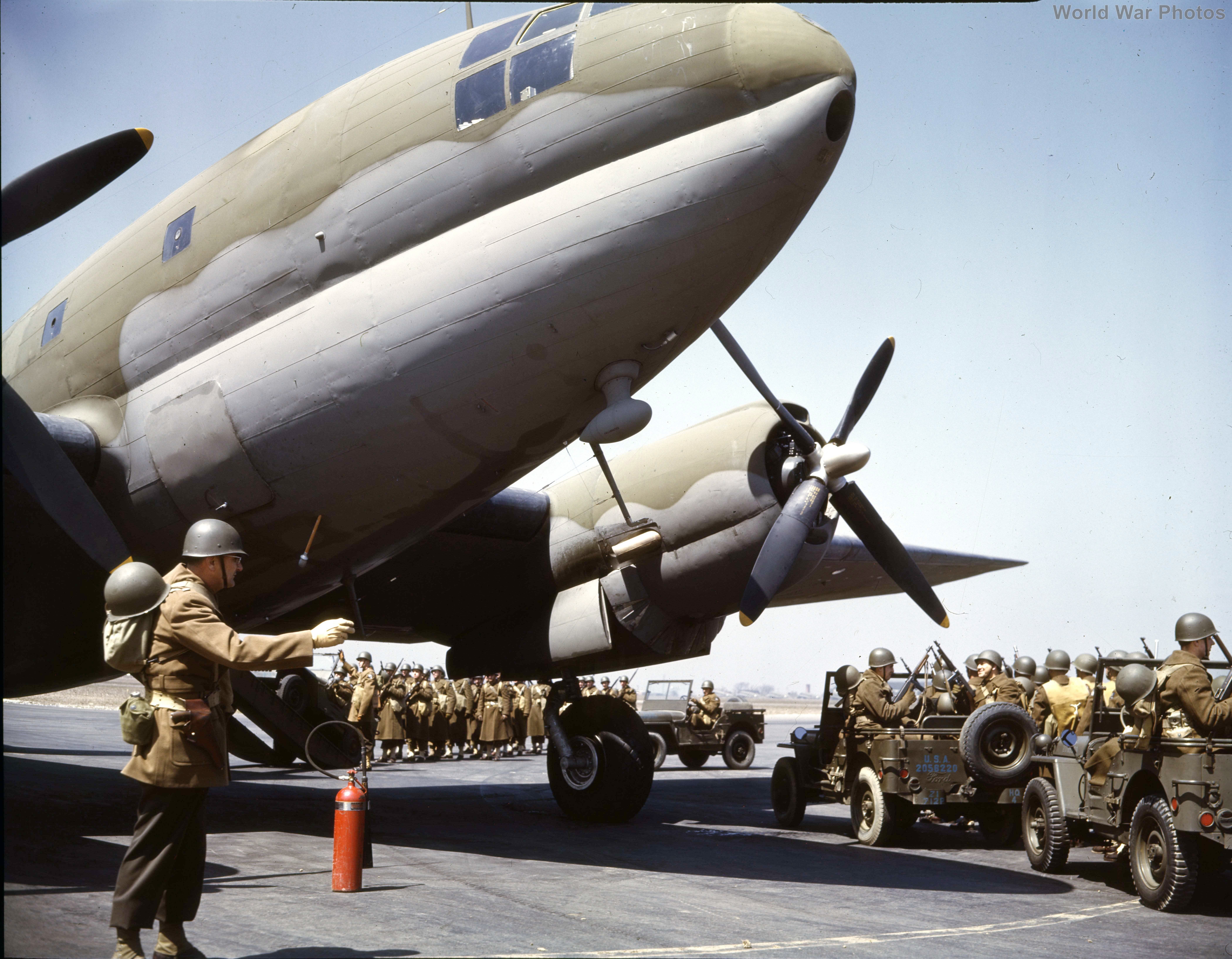 Soldiers waiting to board the C-46A 2