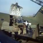 Airmen load Sikorsky R-4 into a C-46