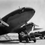 Jeep beside C-46 Commando and P-40 Warhawk