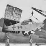 Flight crews unload AE-1 30289 from a C-46 at Peleliu