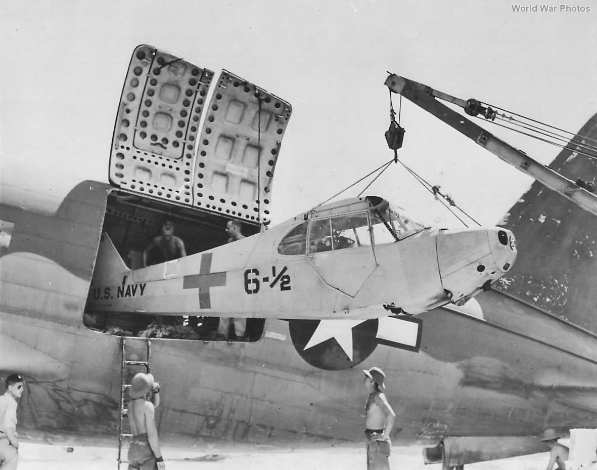Flight crews unload AE-1 30289 from a C-46 at Peleliu