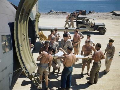 Wounded Marine being loaded on transport