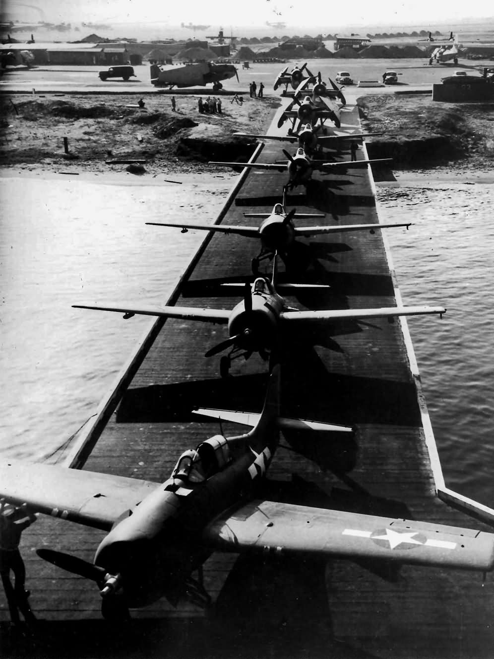 FM-1 Wildcats and TBM-1 Avengers from VC-42 during loading on board USS Guadalcanal CVE-60 at NAS San Diego, 31 October 1943