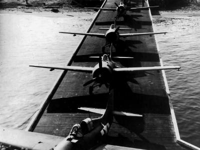 FM-1 Wildcats and TBM-1 Avengers from VC-42 during loading on board USS Guadalcanal CVE-60 at NAS San Diego, 31 October 1943