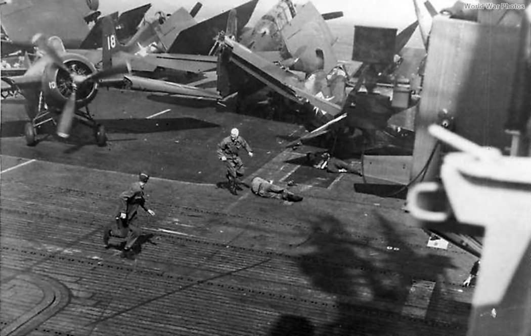 Crewmen on carrier knocked down by runaway Wildcat 1945 1