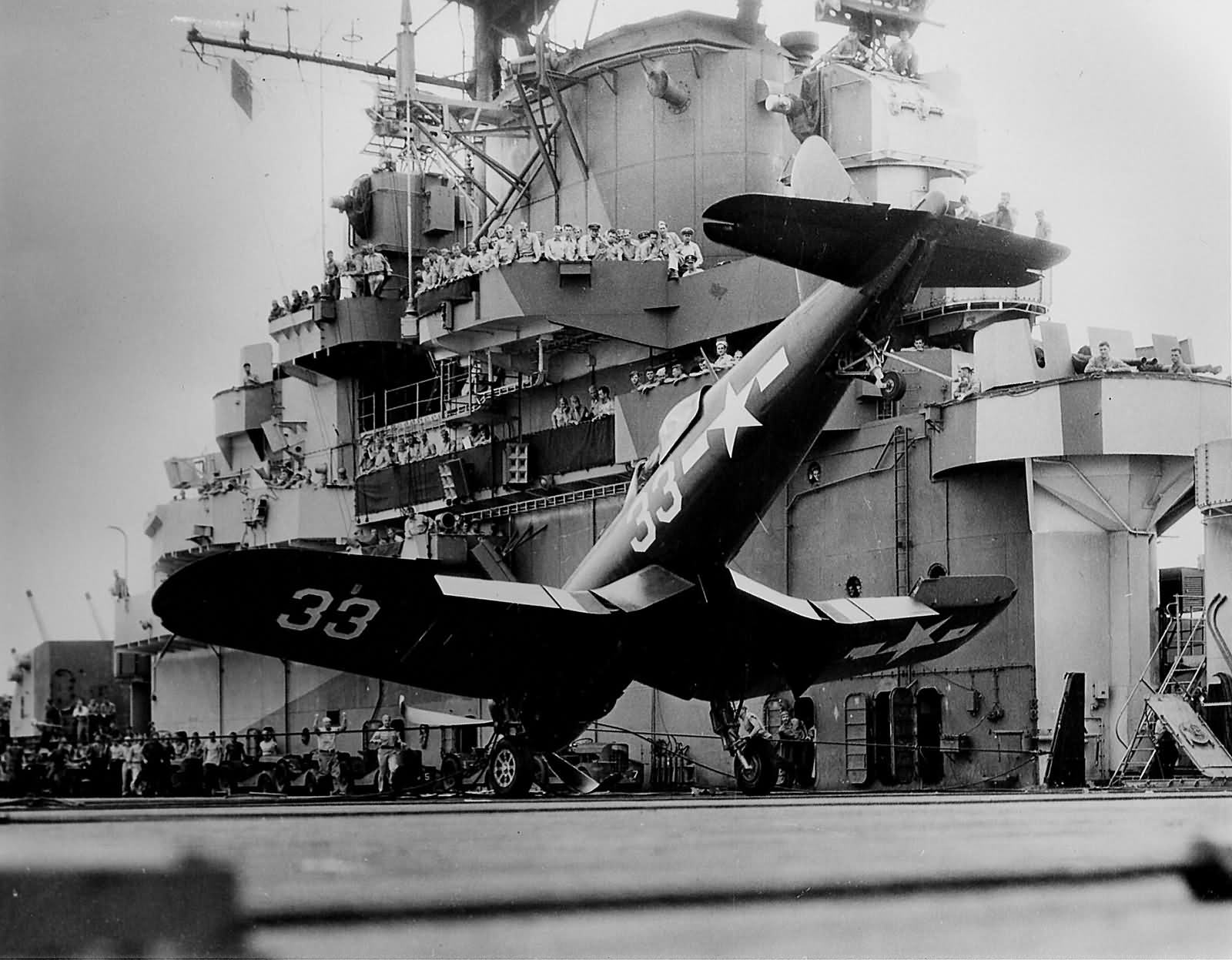 F4U-1D Corsair #33 of VBF-85 up on its nose USS Shangri La CV-38 December 6 1944