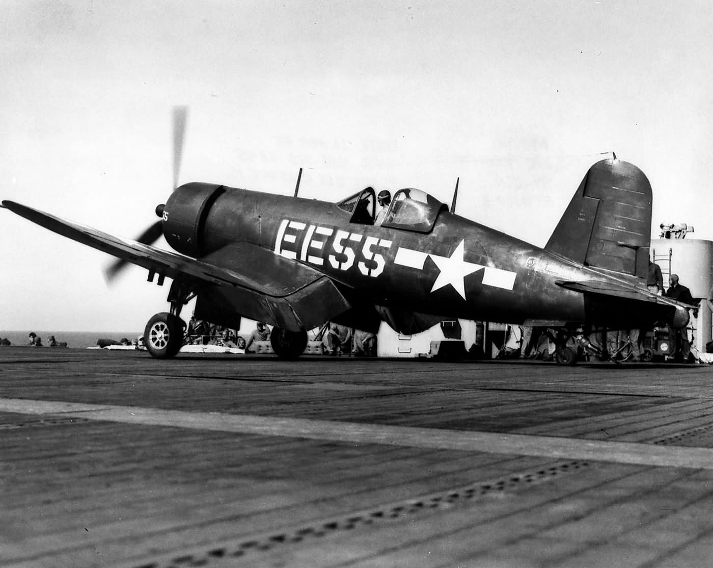 F4U-1D Corsair code EE55 of VMF-512 on a catapult ready to launch from the USS Gilbert Islands CVE-107 – March 6, 1945