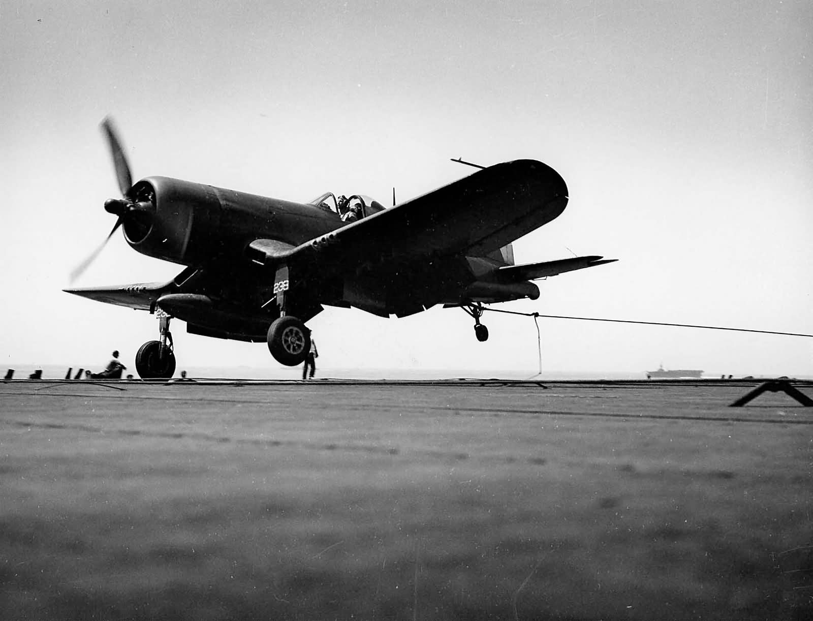 F4U-1D Corsair of VBF-83 catches a wire on board the carrier USS Essex CV-9 1945